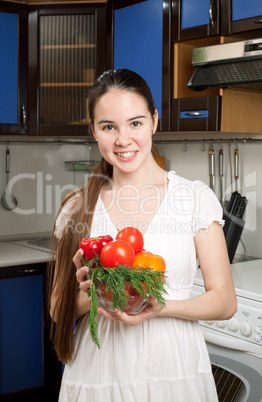 young beautiful caucasian woman in the kitchen