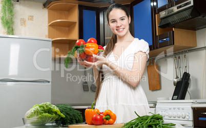 young beautiful caucasian woman in the kitchen