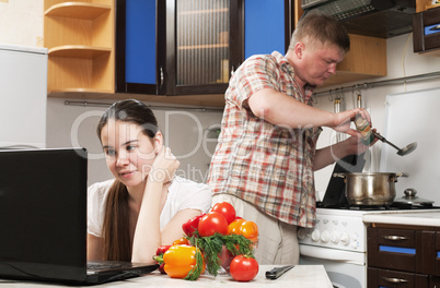 young beautiful caucasian woman in the kitchen