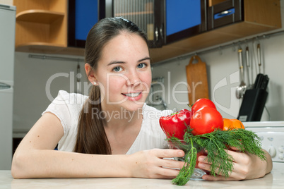 young beautiful caucasian woman in the kitchen