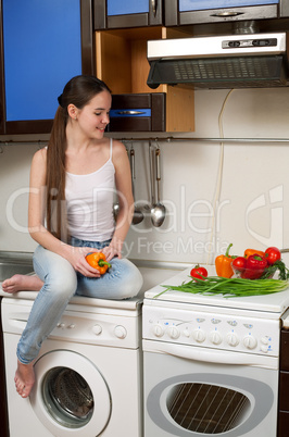 young beautiful caucasian woman in the kitchen