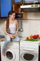 young beautiful caucasian woman in the kitchen