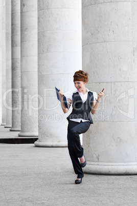 business woman in gray columns