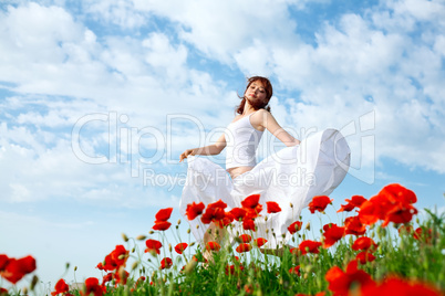 beauty woman in poppy field
