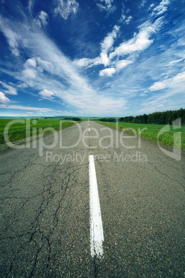 asphalt road in field