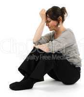 Woman is sitting on the floor