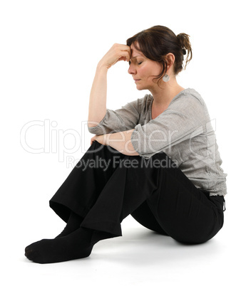 Woman is sitting on the floor