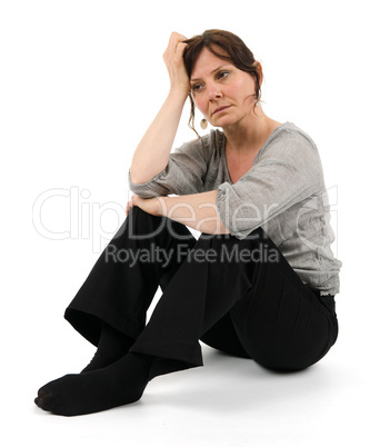Woman is sitting on the floor