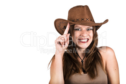 Sexy cowgirl smiling and tapping her hat