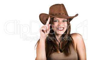 Sexy cowgirl smiling and tapping her hat