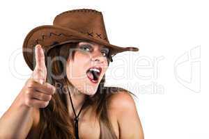 Sexy lady with cowboy hat making the pistol