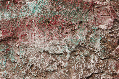 Concrete partially covered with colored paints