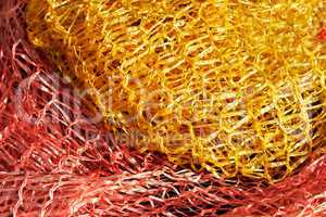 Yellow and red plastic mesh