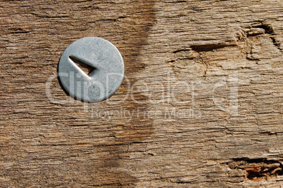 Metal pin in wooden board