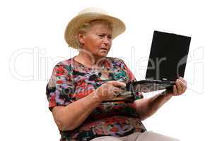 Seniorin mit einem Computer