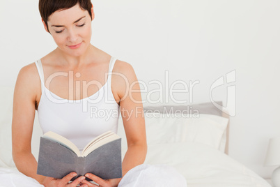 Lovely woman reading a book