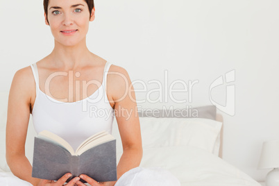 Lovely woman holding a book
