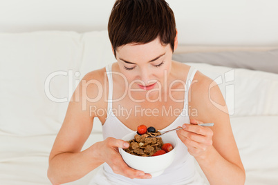 Lovely brunette having breakfast