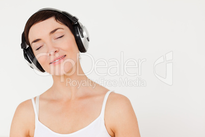 Close up of a woman listening to music