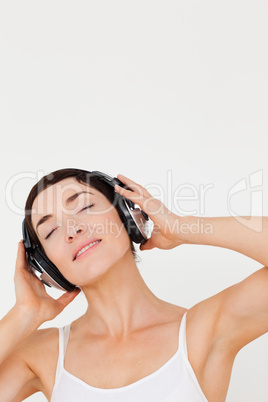 Portrait of a young woman listening to music