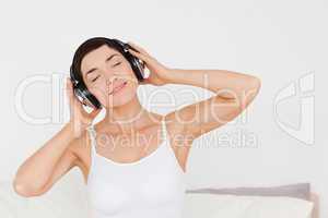 Delighted woman listening to music