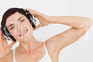 Close up of a lovely woman listening to music