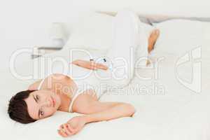 Charming woman lying on her back