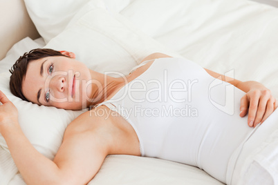 Close up of a calm woman lying on her back