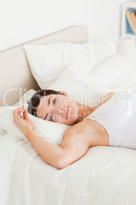 Portrait of a beautiful woman lying on her back