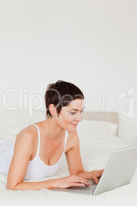 Portrait of a young woman using a laptop