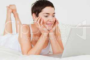 Cute woman using a laptop