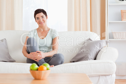 Woman sitting on a sofa