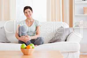 Woman sitting on a sofa