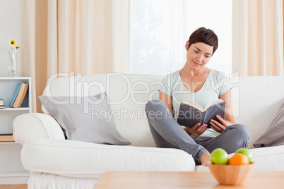 Lovely woman reading a book