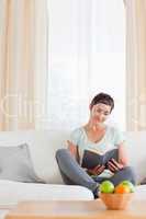 Portrait of a lovely woman reading a book