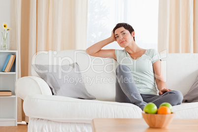 Smiling woman sitting on a sofa