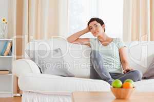 Smiling woman sitting on a sofa