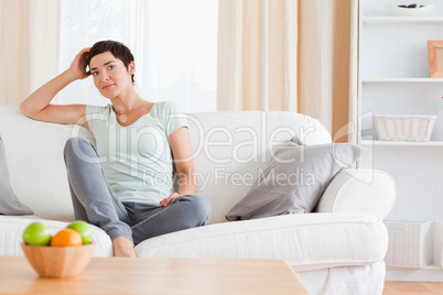 Lovely woman sitting on a sofa