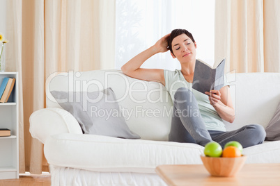 Charming woman reading a book