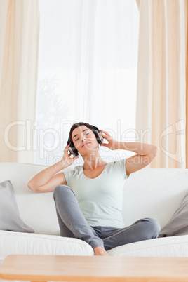 Portrait of a brunette enjoying some music