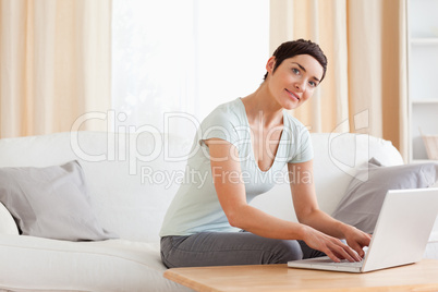 Cute woman working with a laptop