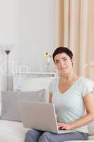 Portrait of a cute woman working with a laptop