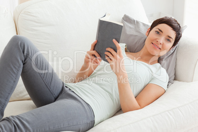 Beautiful brunette holding a book