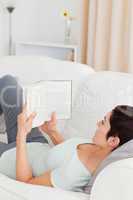 Short-haired woman reading a book