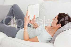 Short-haired brunette reading a book