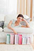 Young woman looking into shopping bags