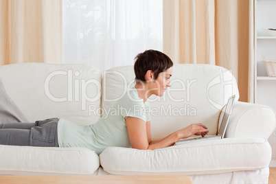 Short-haired woman using a laptop