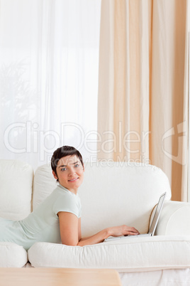 Portrait of a short-haired woman with a laptop