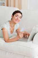 Portrait of a cute woman shopping online