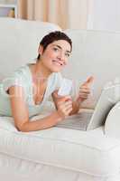 Portrait of a happy woman shopping online